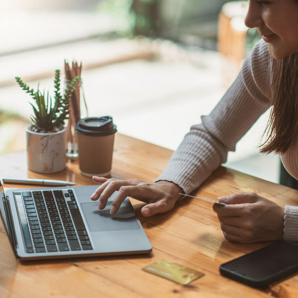Lady purchasing online via a laptop Lady purchasing online via a laptop